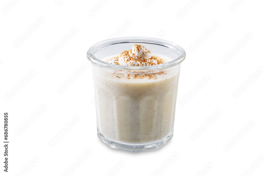 Eggnog with cinnamon decorated with whipped cream in a glass on a white isolated background Eggnog with cinnamon decorated with whipped cream in a glass on a white isolated background