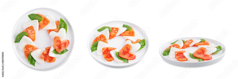 Caprese salad with tomatoes and mozzarella in the shape of hearts for Valentine's Day on a white isolated background Caprese salad with tomatoes and mozzarella in the shape of hearts for Valentine's Day on a white isolated background