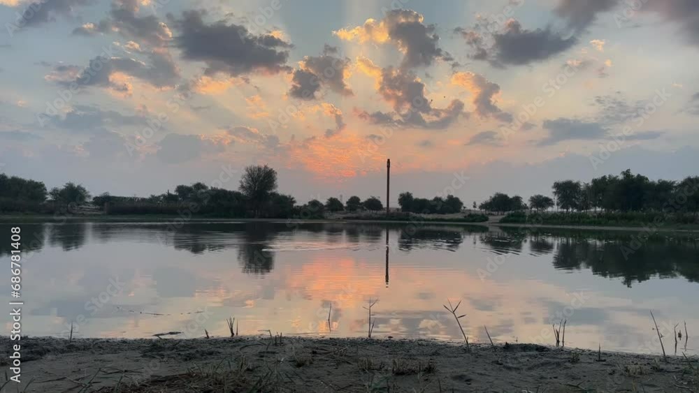 Sunrise  over lake with a Symphony of Colors in the Morning Clouds
