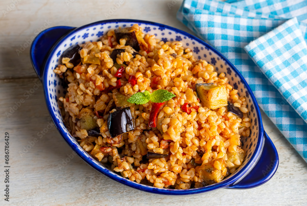 Traditional delicious Turkish food; Bulgur pilaf with eggplant and vegetables. (Turkish name; Patlicanli bulgur pilavi) Traditional delicious Turkish food; Bulgur pilaf with eggplant and vegetables. (Turkish name; Patlicanli bulgur pilavi)