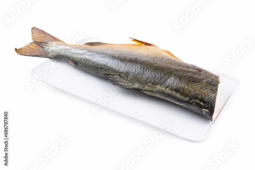 Smoked fish on a white plate from a fish shop
