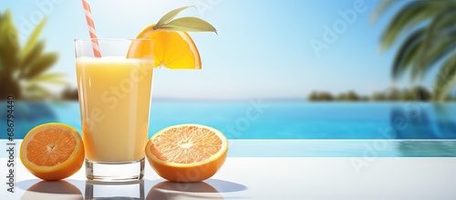 Poolside view of orange juice Copy space image Place for adding text or design