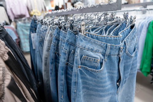 Blue Jeans Hanging on a Hanger in a Stylish Fashion Store Display