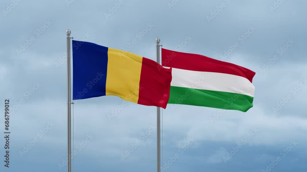 Hungary flag and Chad flag waving together on cloudy sky, endless seamless loop, two country relations concept Hungary flag and Chad flag waving together on cloudy sky, endless seamless loop, two country relations concept