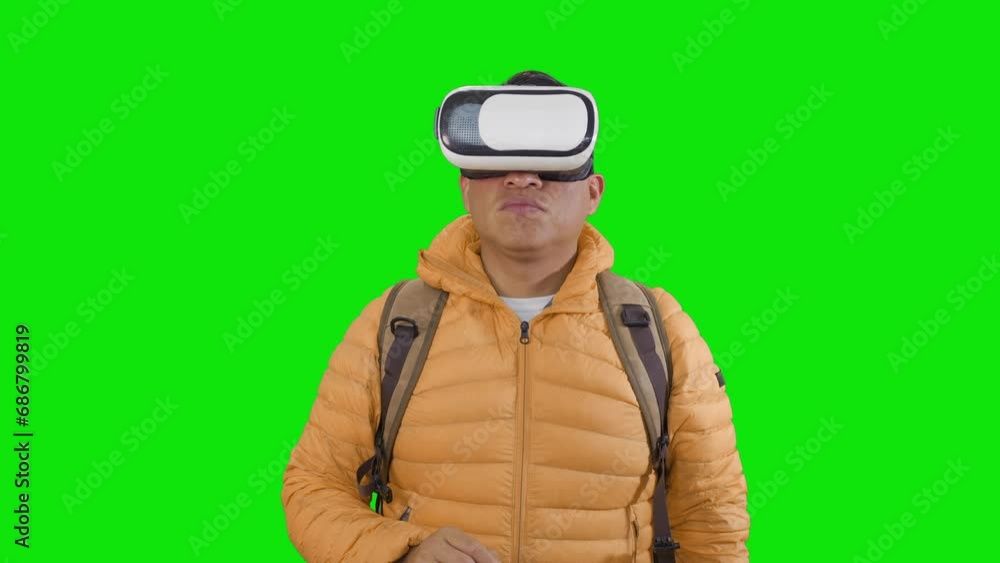 adventurer with a backpack and virtual reality goggles, standing in front of a green background.concept of merging technology and nature, offering a digital hiking experience. adventurer with a backpack and virtual reality goggles, standing in front of a green background.concept of merging technology and nature, offering a digital hiking experience.