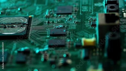 Circuit board with components. Extreme close up of green electronic board, with electronic components.
 photo