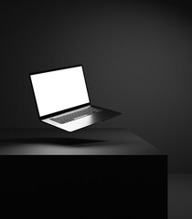 Laptop mock up on the black background with black dark wall and black table stage with spotlight beam and white empty blank screen for design and advertisement, empty white space on laptop screen