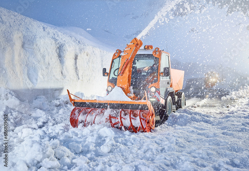 Austria, Tyrol, Hochgurgl, snow-plowing service with snowblower photo