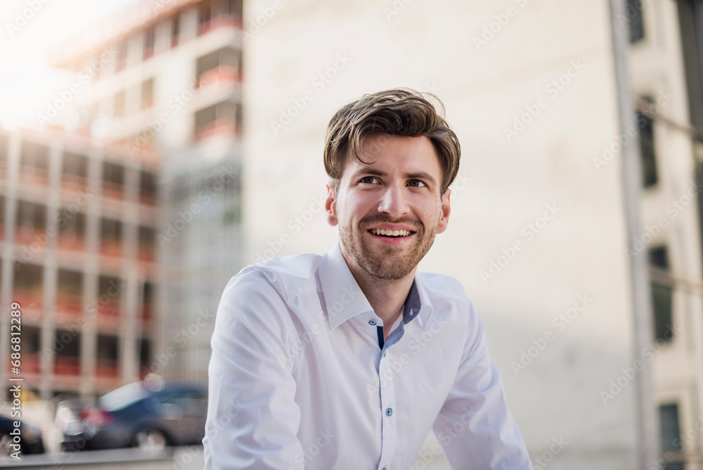 Portrait of smiling businessman in the city Portrait of smiling businessman in the city