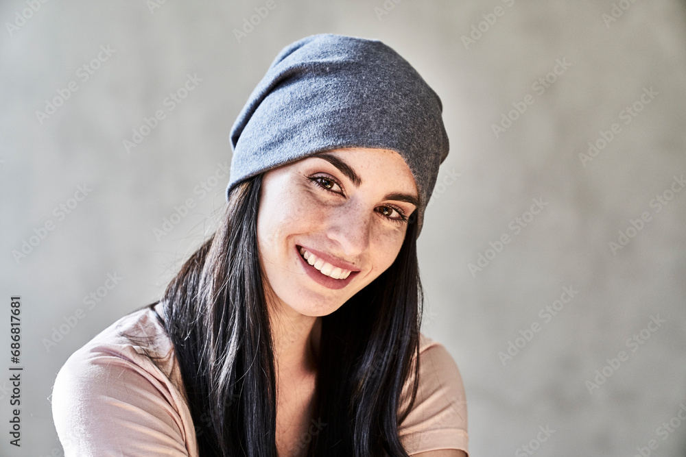 Portrait of smiling young woman wearing beanie Portrait of smiling young woman wearing beanie