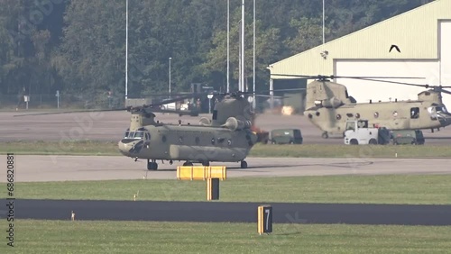 Military Army Transport Helicopters Taxiing Preparing prior take off taking off at air base airport airfield prior a mission evacuation air bridge.