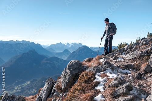 Germany, Bavaria, Berchtesgadener Land, Hochstaufen, hiker looking at view photo