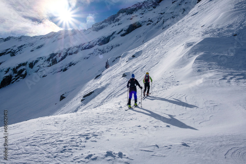Two men doing a ski tour in Faragas mountains, Southern Carpathians, Romania photo