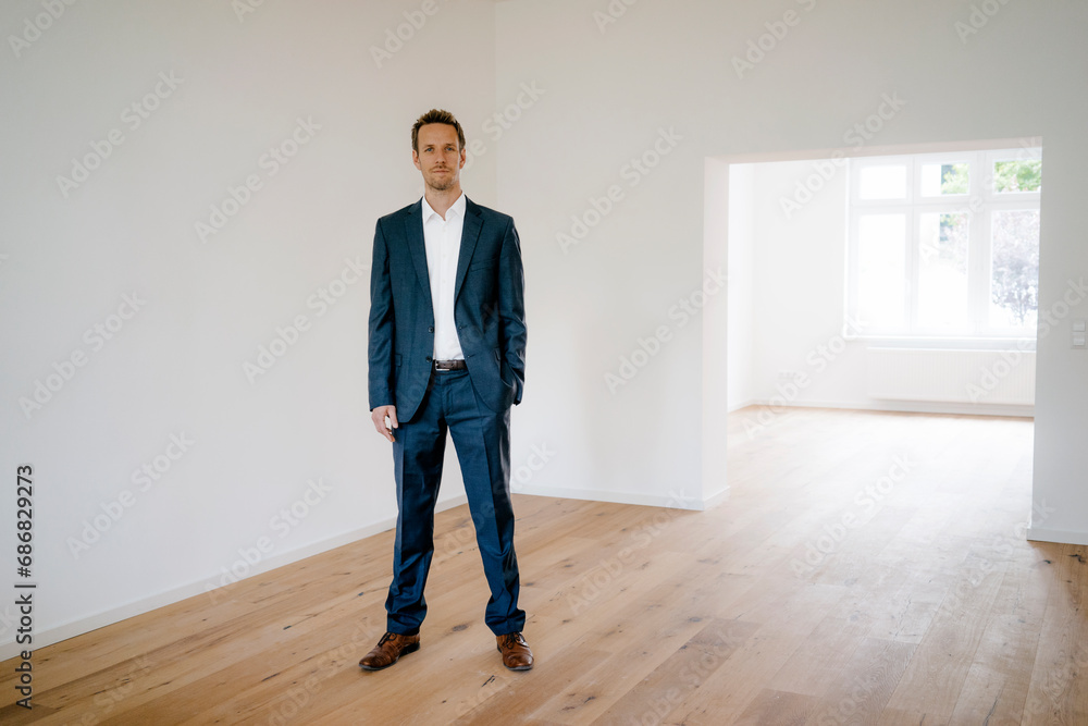 Estate agent waiting in newly refurbished home Estate agent waiting in newly refurbished home
