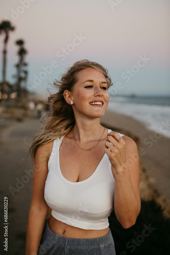 Happy young woman on the beach, Huntington Beach, California, USA © tunedin