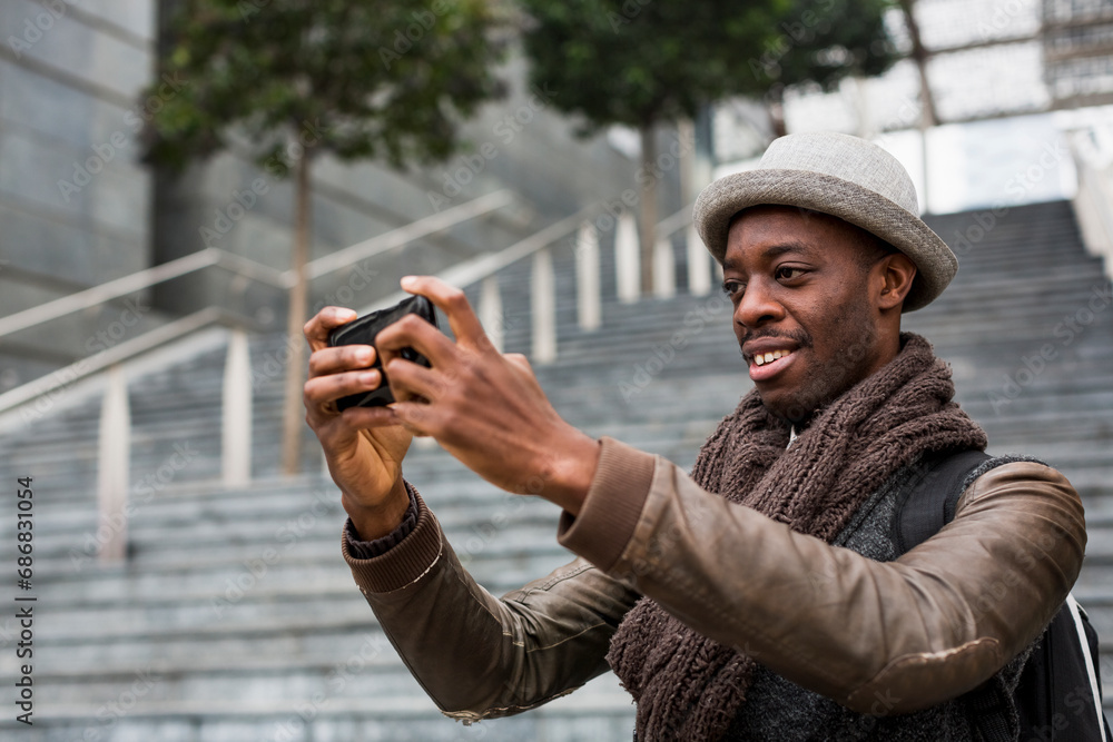 Smiling man taking selfie with smartphone Smiling man taking selfie with smartphone