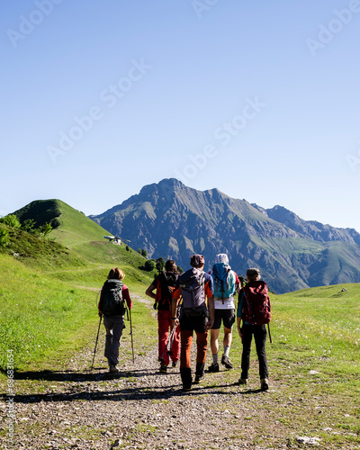 Group of hikers walking in the mountains, Orobie Mountains, Lecco, Italy