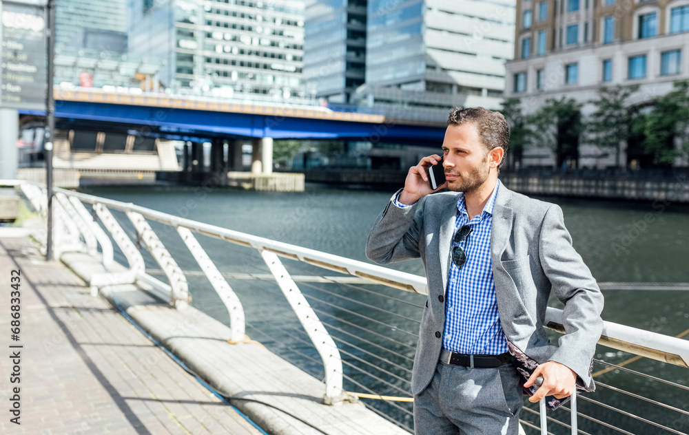 Businessman talking on the phone in the city Businessman talking on the phone in the city