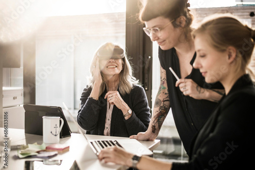 Creative businesswomen working together in office photo