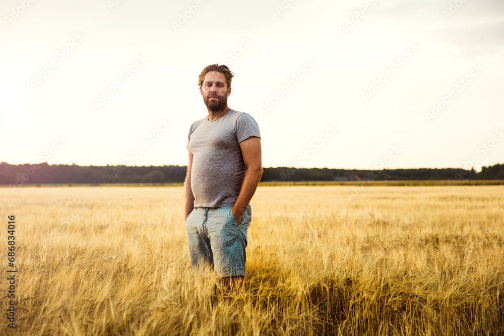 Man standing in grain field