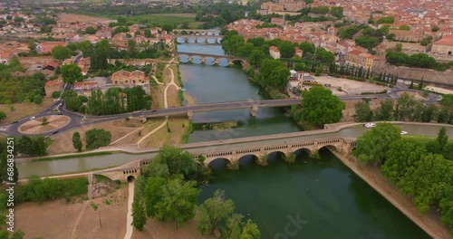 Aerial view the old town of Beziers in France on a sunny day in summer. Beautiful view of the old bridges over the river photo