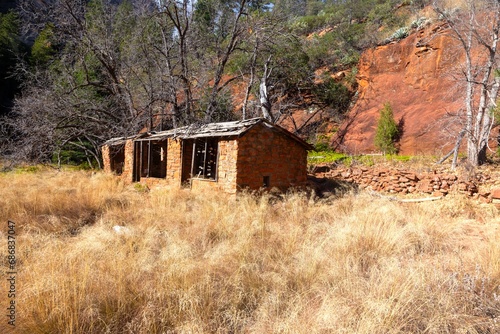 America Settler Legacy, Historic Sedona Mayhew Lodge Old Stone Decaying Ruins Exterior Side View. Oak Creek Canyon West Fork, Arizona Southwest US State Park photo