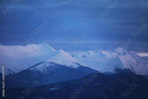 Winter alpine landscape in National Park Retezat, Carpathians, Romania, Europe. Snow covered moutains scenery  © Rechitan Sorin