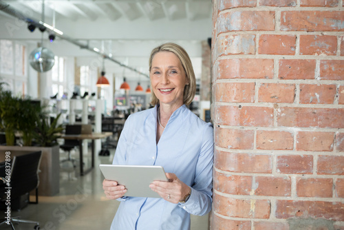 Photography Mature businesswoman using digital tablet