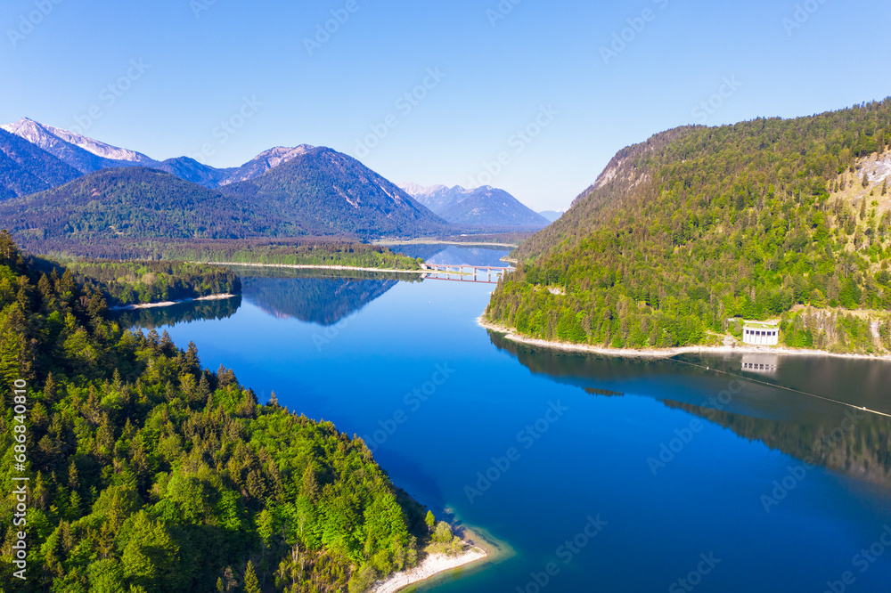 Germany, Bavaria, Lenggries, Sylvenstein Reservoir in spring with Faller-Klamm-Brucke in background