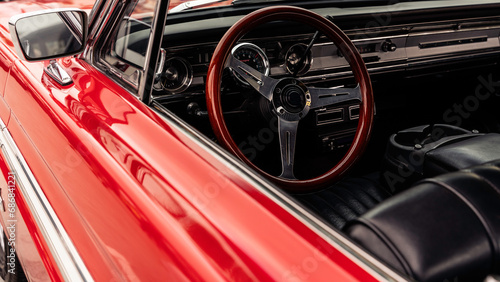 Vintage and classic car with a red body and leather interior