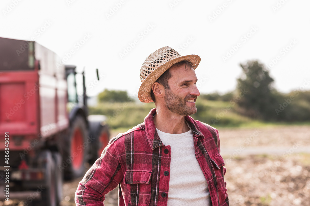 Portrait of confident farmer on field