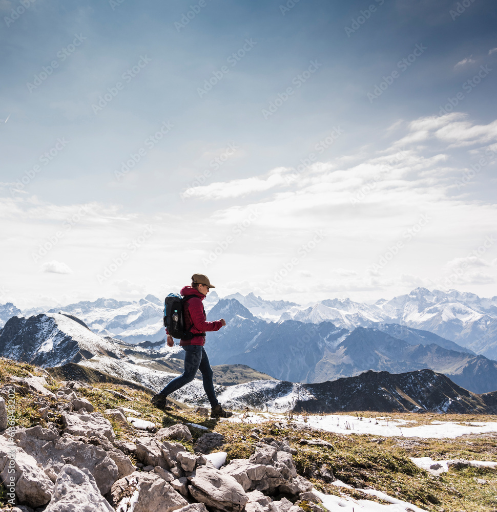 Germany, Bavaria, Oberstdorf, hiker walking in alpine scenery