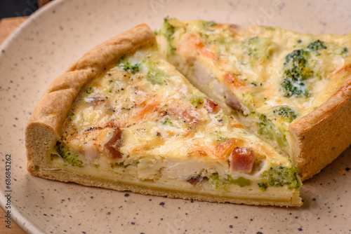 Delicious quiche with broccoli, cheese, chicken, spices and herbs