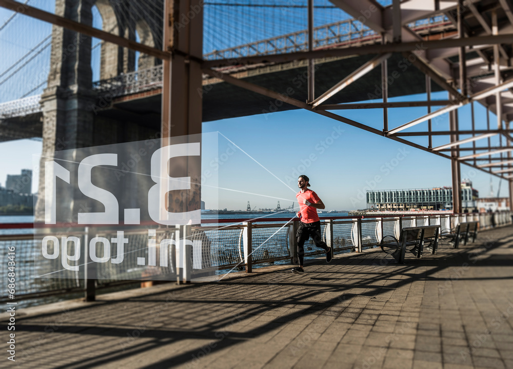 USA, New York City, man running at East River with data emerging from smartwatch