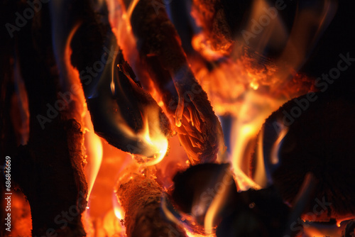 Bright fire of high temperature from natural firewood burns in fireplace