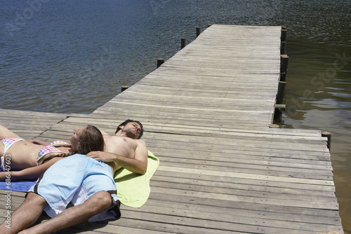 Couple Relaxing on Dock photo
