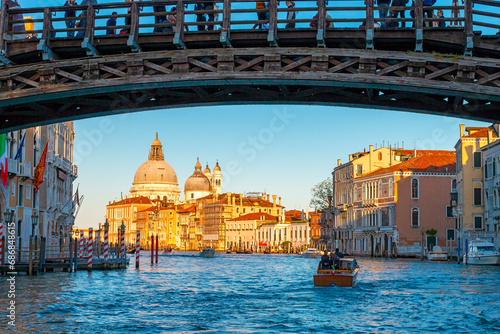 Grand canal with dell' Accademia bridge in Venice at sunset, with view of the basilica Santa Maria delle Salute, Italy photo