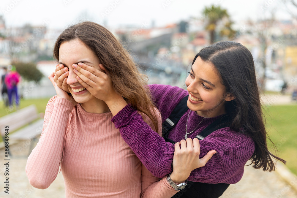 Two young women having fun in the city, Porto, Portugal Two young women having fun in the city, Porto, Portugal