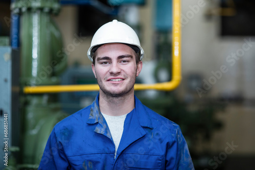 Portrait of confident worker in factory © tunedin