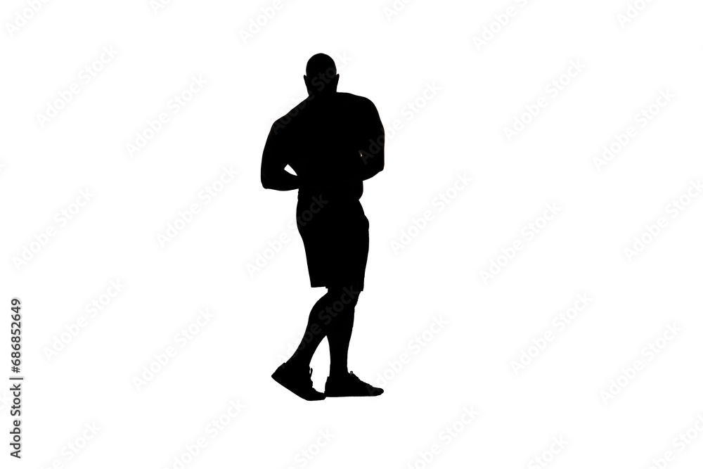 In the shot a man stands in silhouette against a white background. He is an athlete, bodybuilder, bodybuilder. Demonstrates his body, biceps and muscles. He is looking at the camera with his arm bent