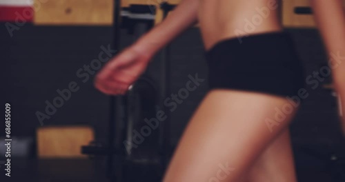 Woman, body and walking in underwear for fitness with confidence, sexy and skin for wellness in gym. Person, athlete and topless with buttocks and attractive for body positivity, exercise or workout photo