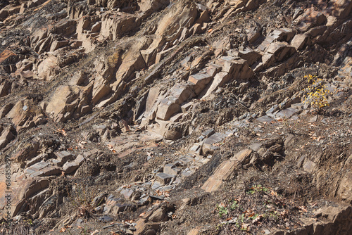 Texture cracked rock formation rock in the wild. Rocky cliff. Abstract Stone texture. Steep cliff of high mountain. Nature background  geological structure. Marble rocks in the wild. Detail Of Granite