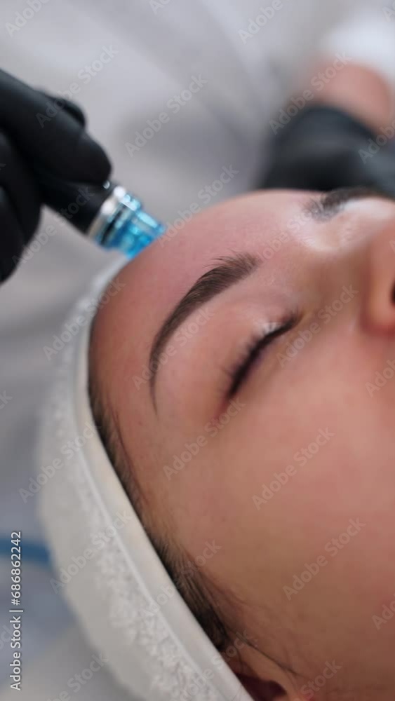 custom made wallpaper toronto digitalSkincare specialist performs hydrafacial treatment on client. Hydro dermabrasion technique cleanses, exfoliates, extracts, hydrates skin. Beauty spa offers anti-aging facial rejuvenation services.