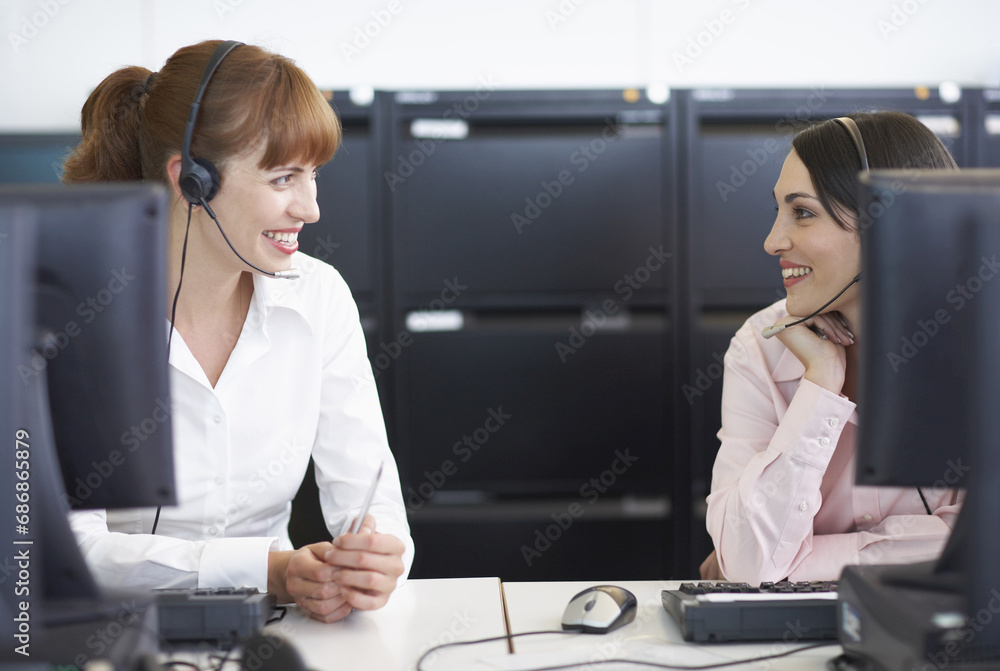 Businesswomen Working on Computers with Headsets Businesswomen Working on Computers with Headsets