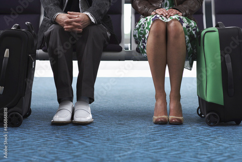 Man and Woman in Airport Waiting Area photo