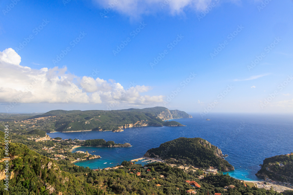 View in the evening under a blue sky over the bay and the sea at Paleokastrtitsa on the island of Corfu