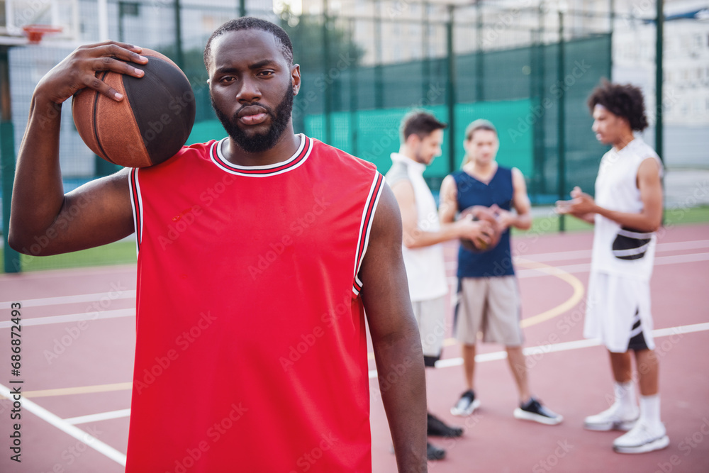 Guys playing basketball