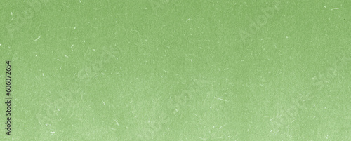 Recycled green paper background and texture. Craft eco textured paper sheet background beige color for cards and other design ideas beige color.White paper texture with particles. Paper background