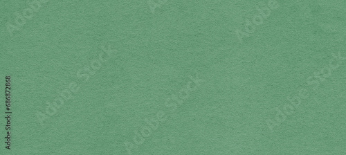 Recycled green paper background and texture. Craft eco textured paper sheet background beige color for cards and other design ideas beige color.White paper texture with particles. Paper background