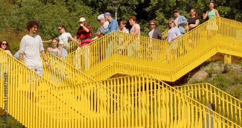 An inspired group people walk down stairs city Social Events Youth groups might use urban stairs meeting place organizing social events could include picnics celebrations simply spending time together